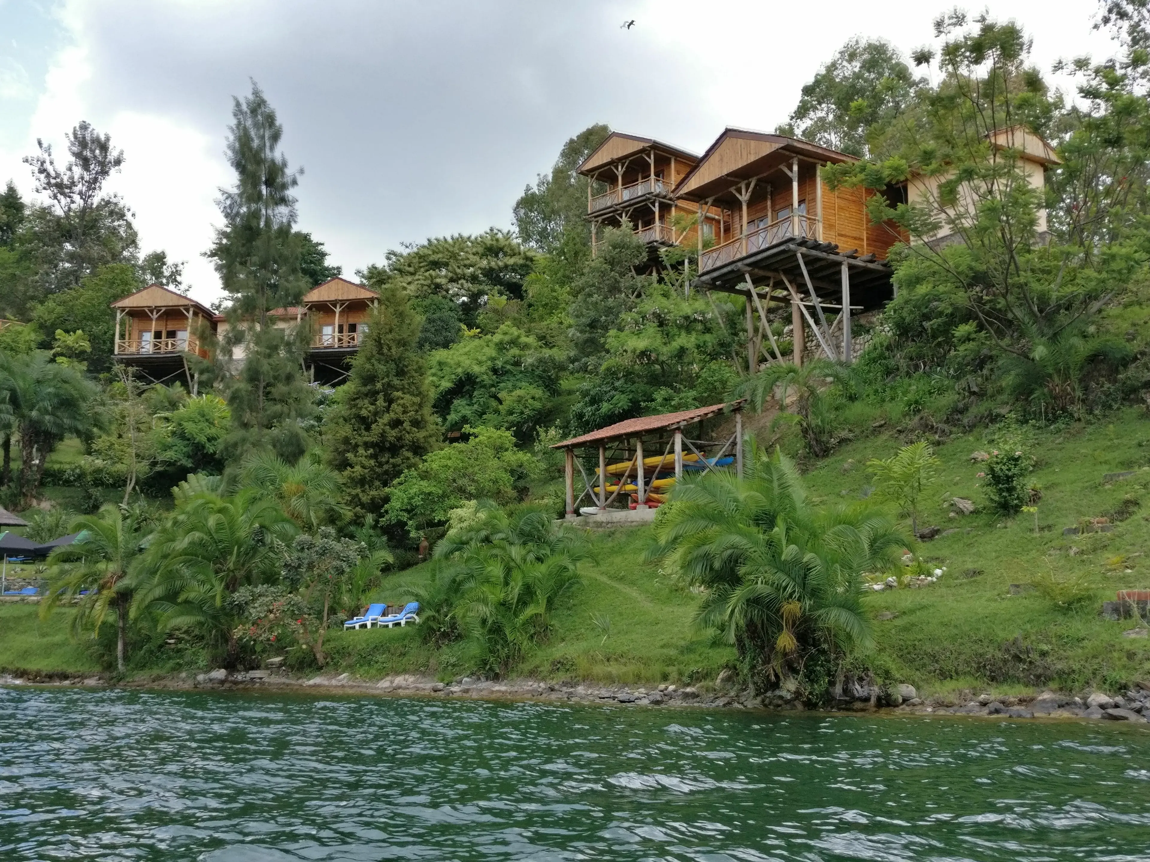 Wooden tourist lodges on the shores of lake Kivu