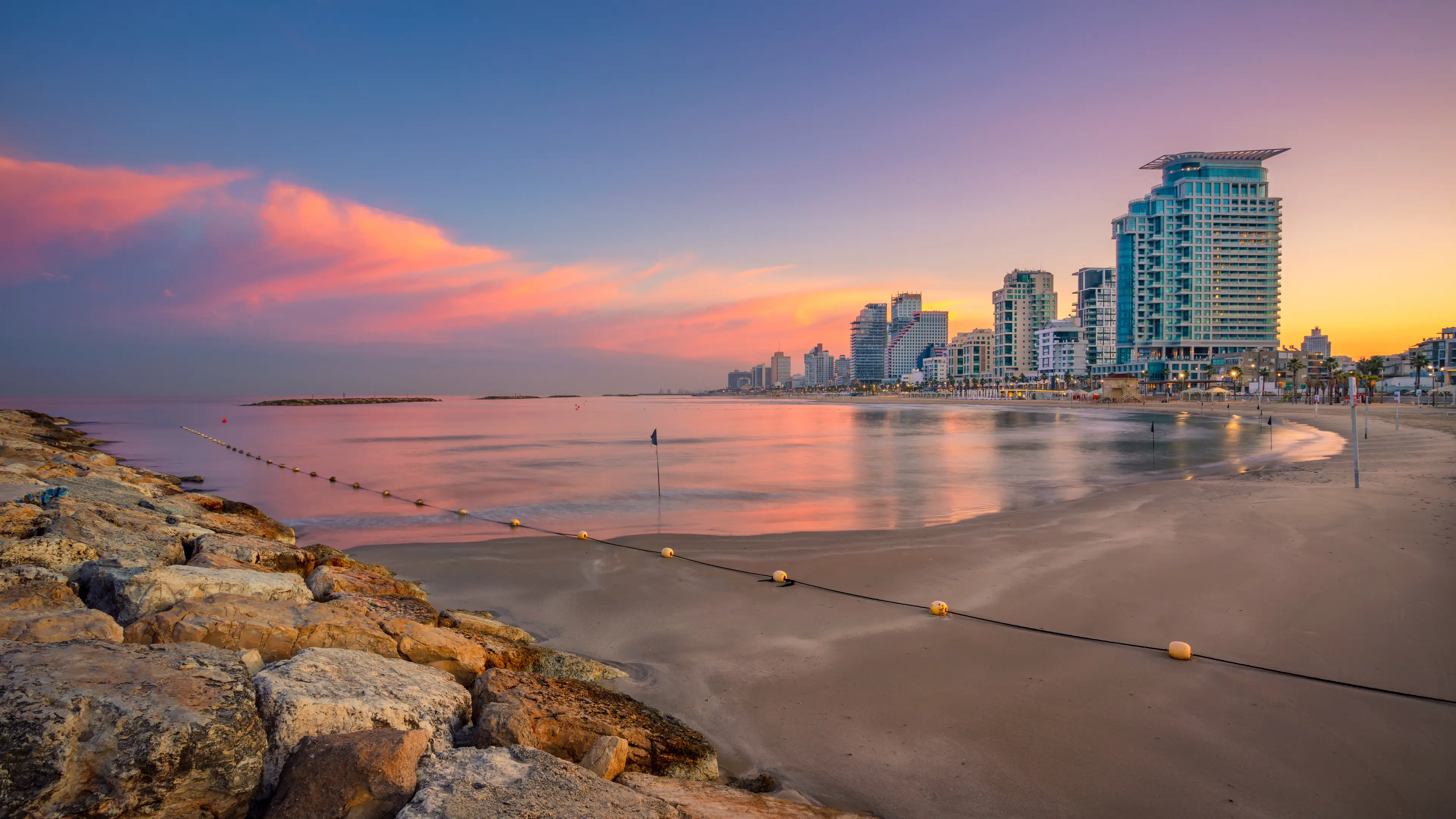 Sunrise panorama of the city taken from the beach Sunrise panorama of the city taken from the beach