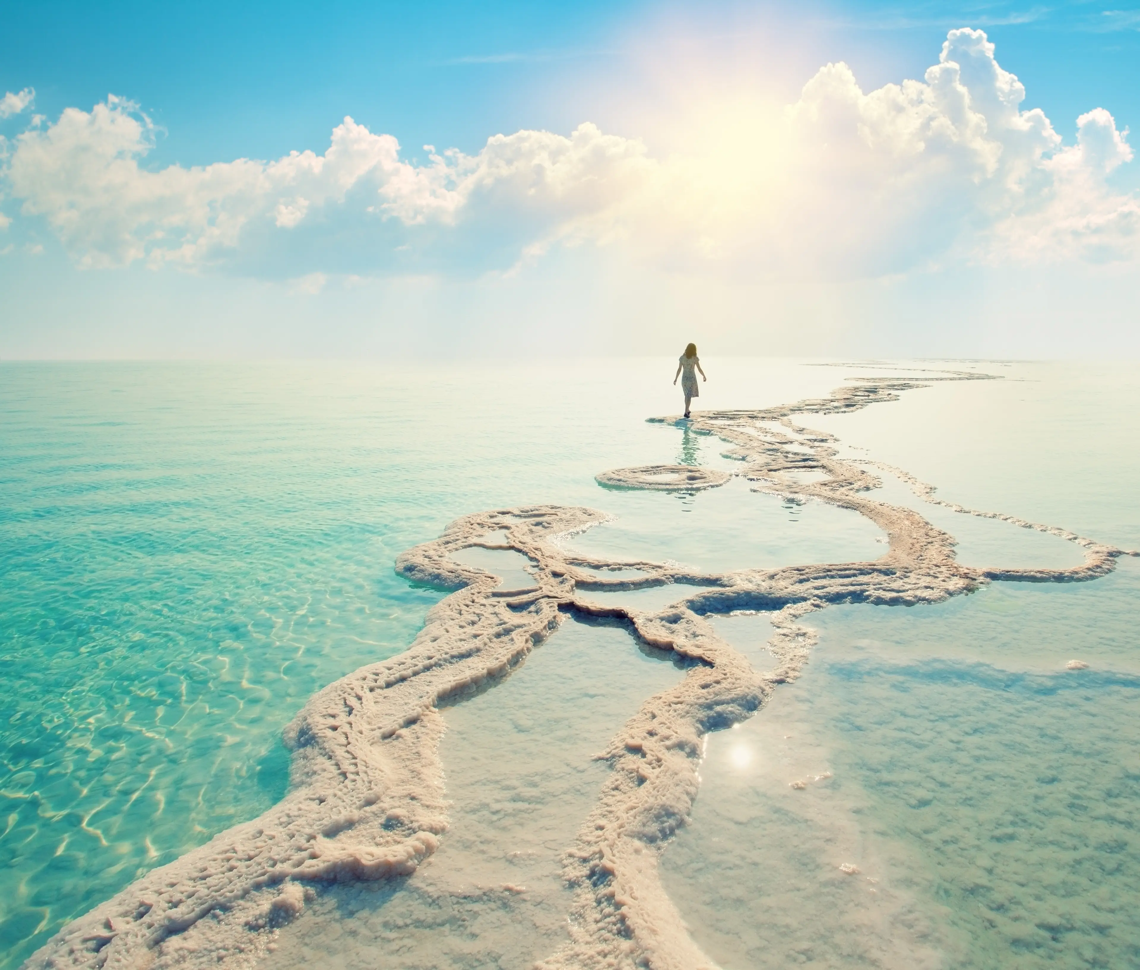 Woman walking on solid salt formations Woman walking on solid salt formations