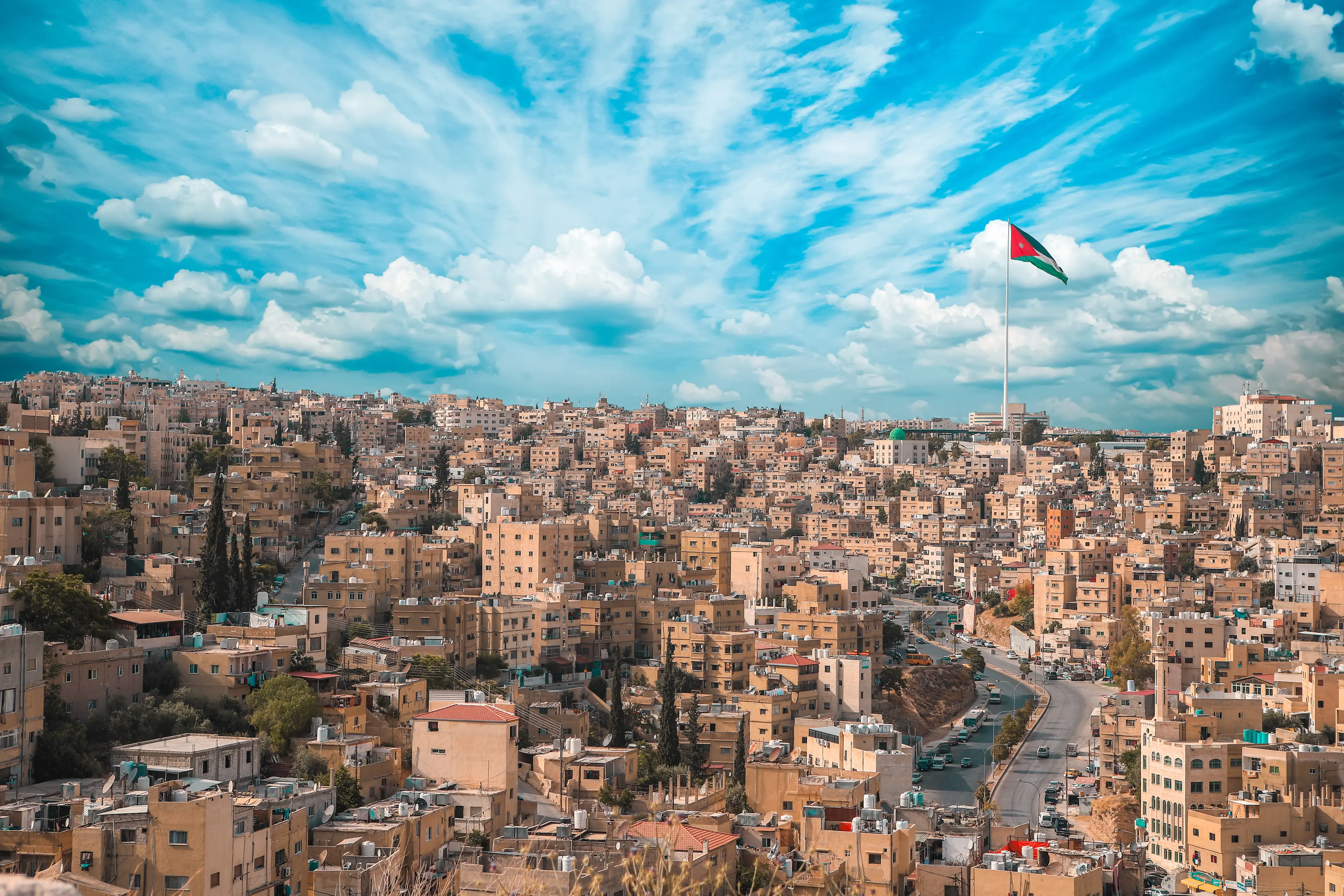 City skyline with Jordanian flag
