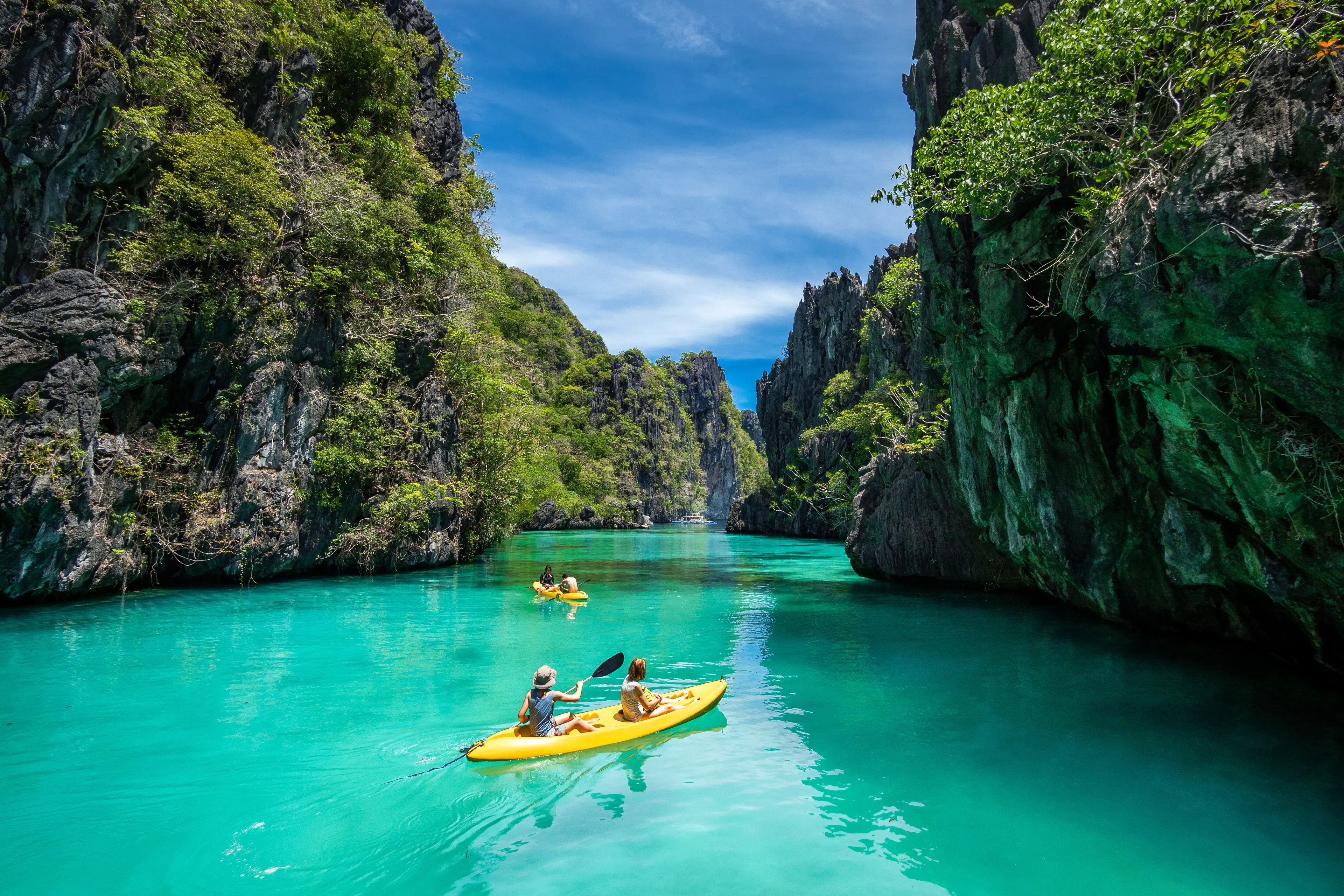 Tourists kayaking and exploring the natural sights around El Nido