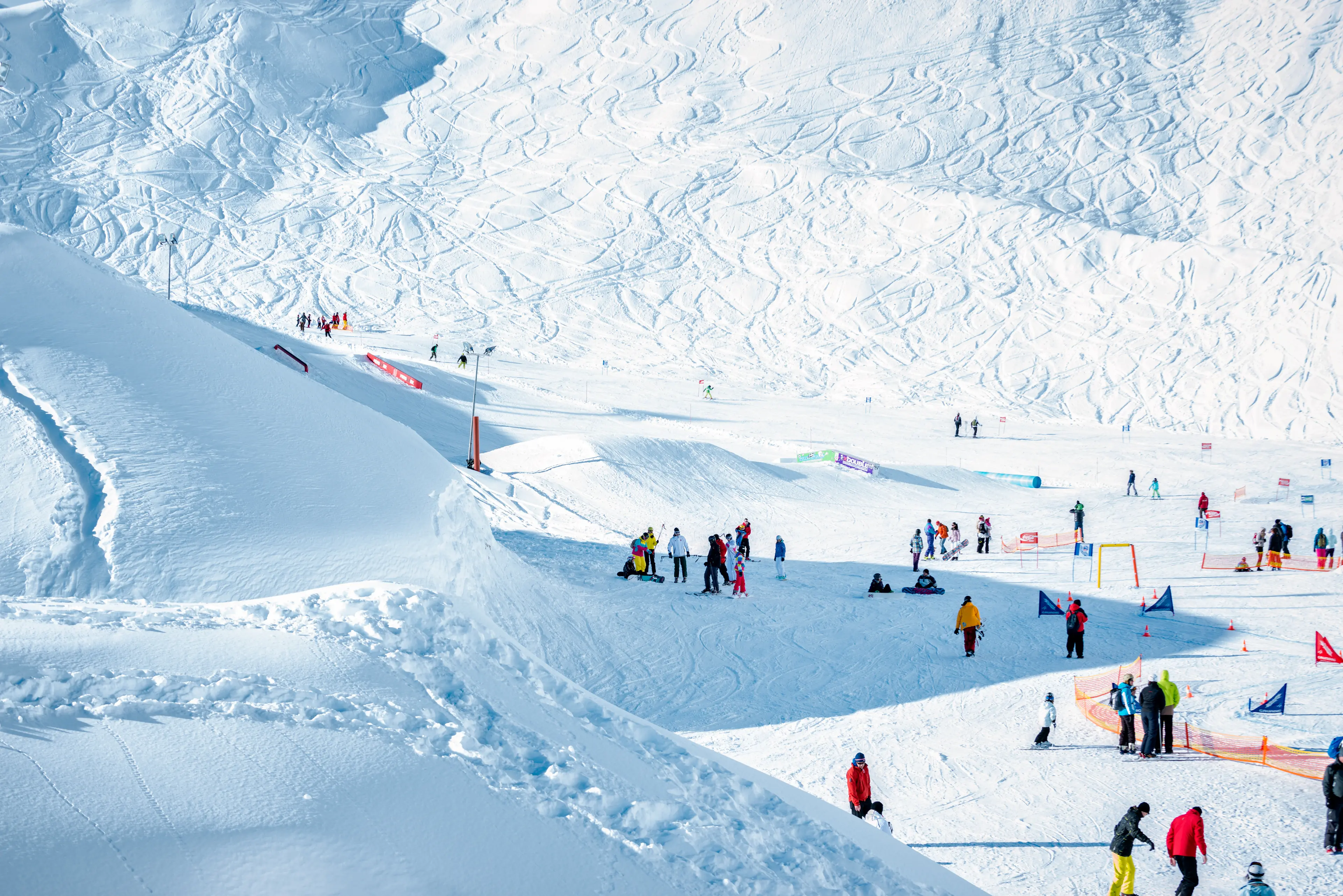 People enjoying an alpine ski resort People enjoying an alpine ski resort