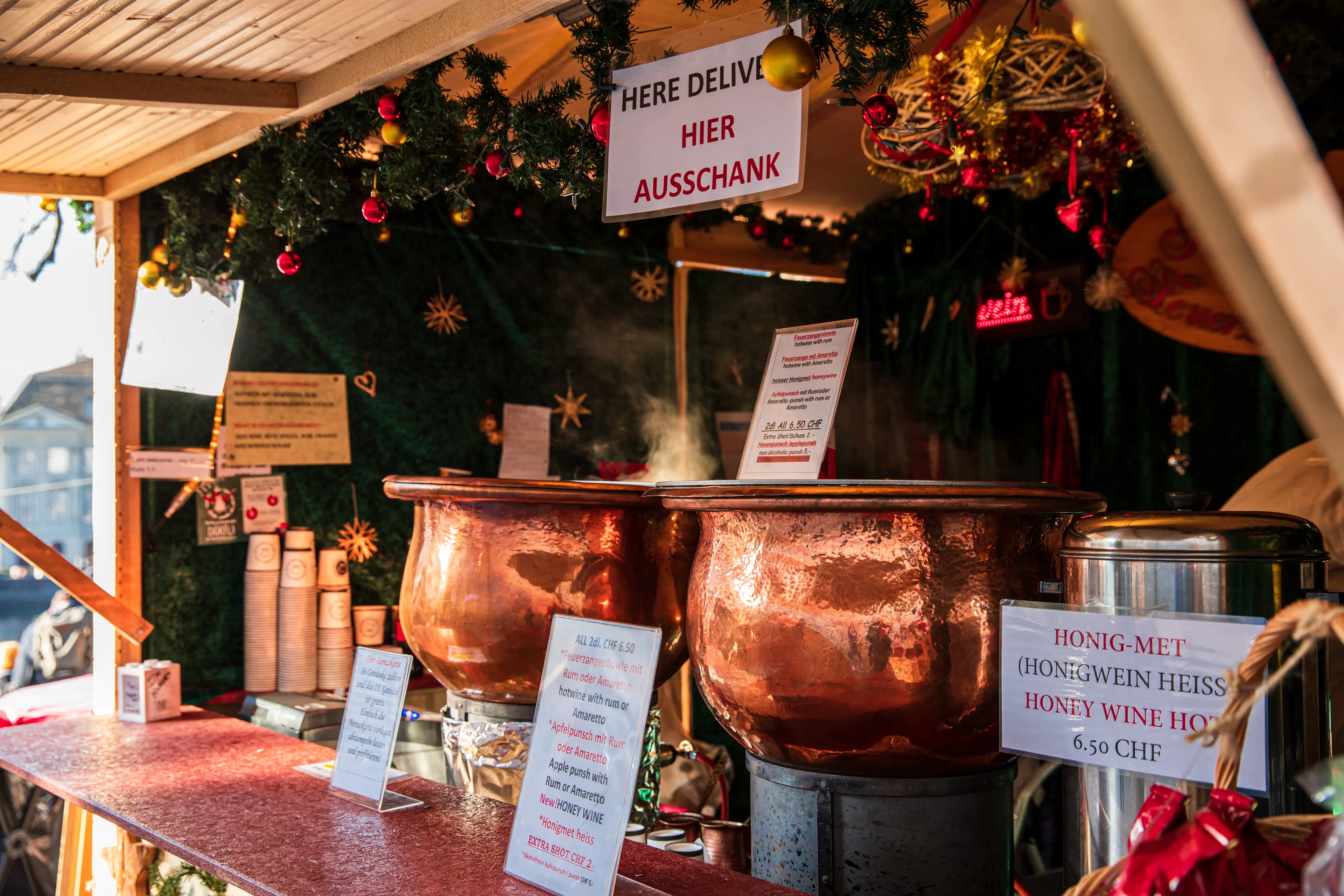 Hot mulled wine in the Christmas market around the Grossmunster Church Hot mulled wine in the Christmas market around the Grossmunster Church