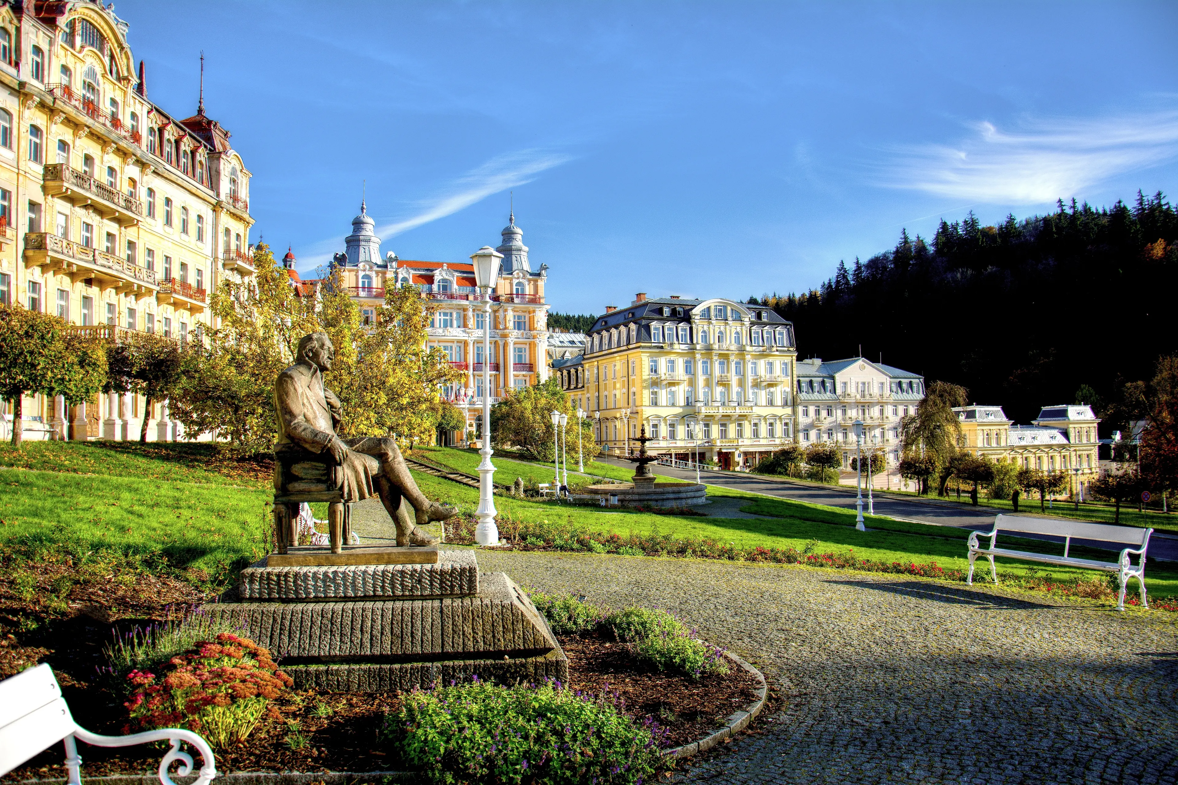 Goethe square with statue, hotel buildings and fountain in the spa park of the town Marianske Lazne (Marienbad)
