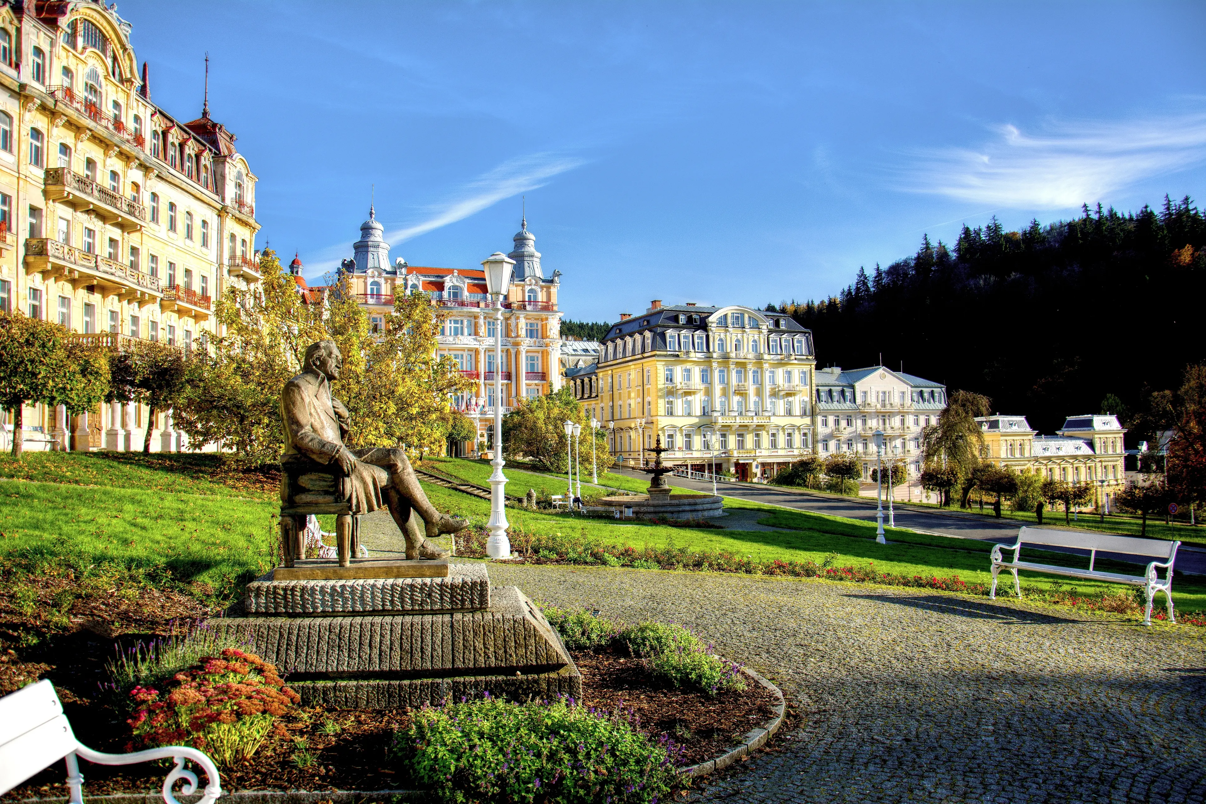 Goethe square with statue, hotel buildings and fountain in the spa park of the town Marianske Lazne (Marienbad) Goethe square with statue, hotel buildings and fountain in the spa park of the town Marianske Lazne (Marienbad)