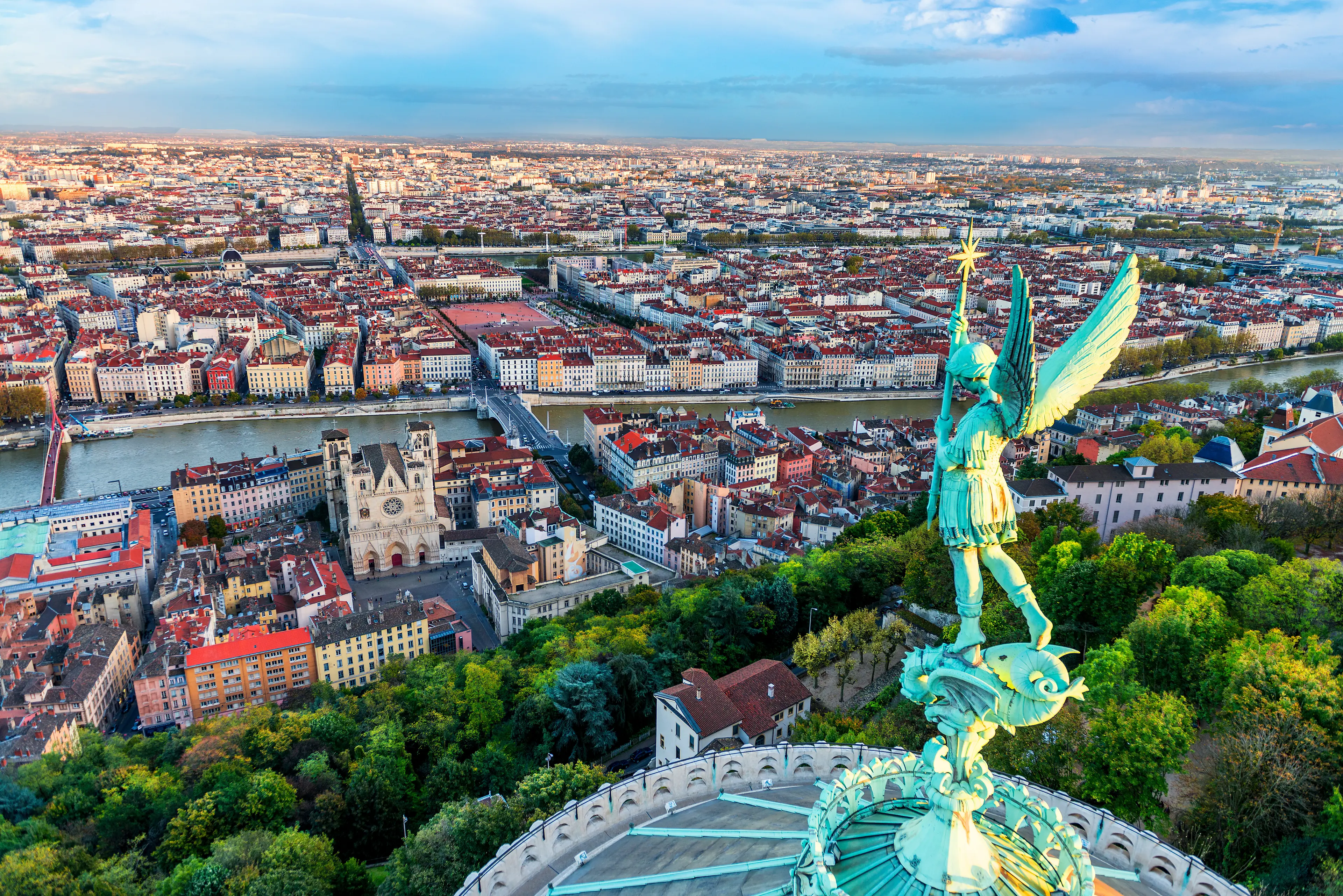 Statue of Archangel Gabriel and view of the city from the Fourviere Basilica