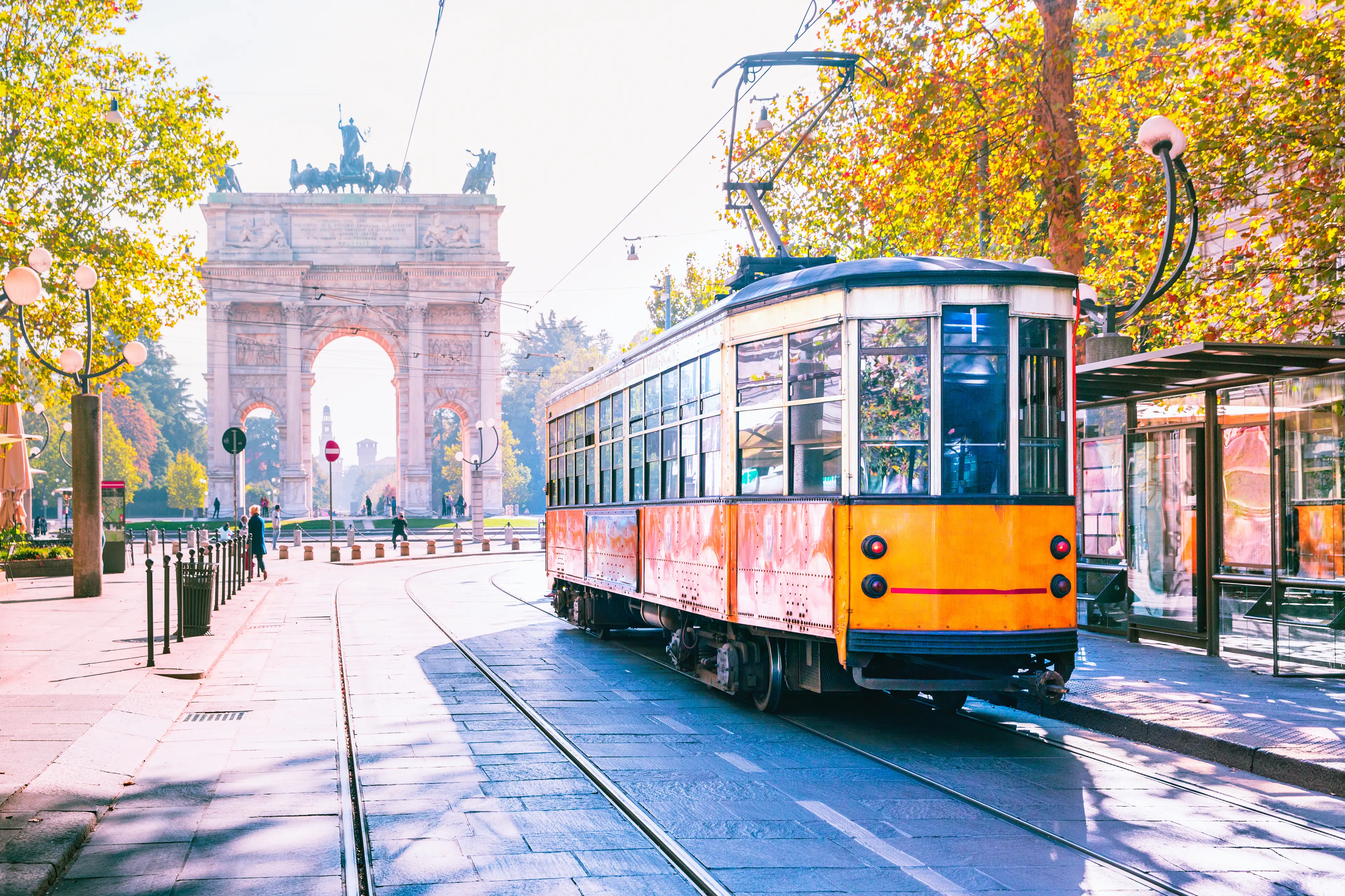 Vintage tram passing nearby the arch of peace Vintage tram passing nearby the arch of peace