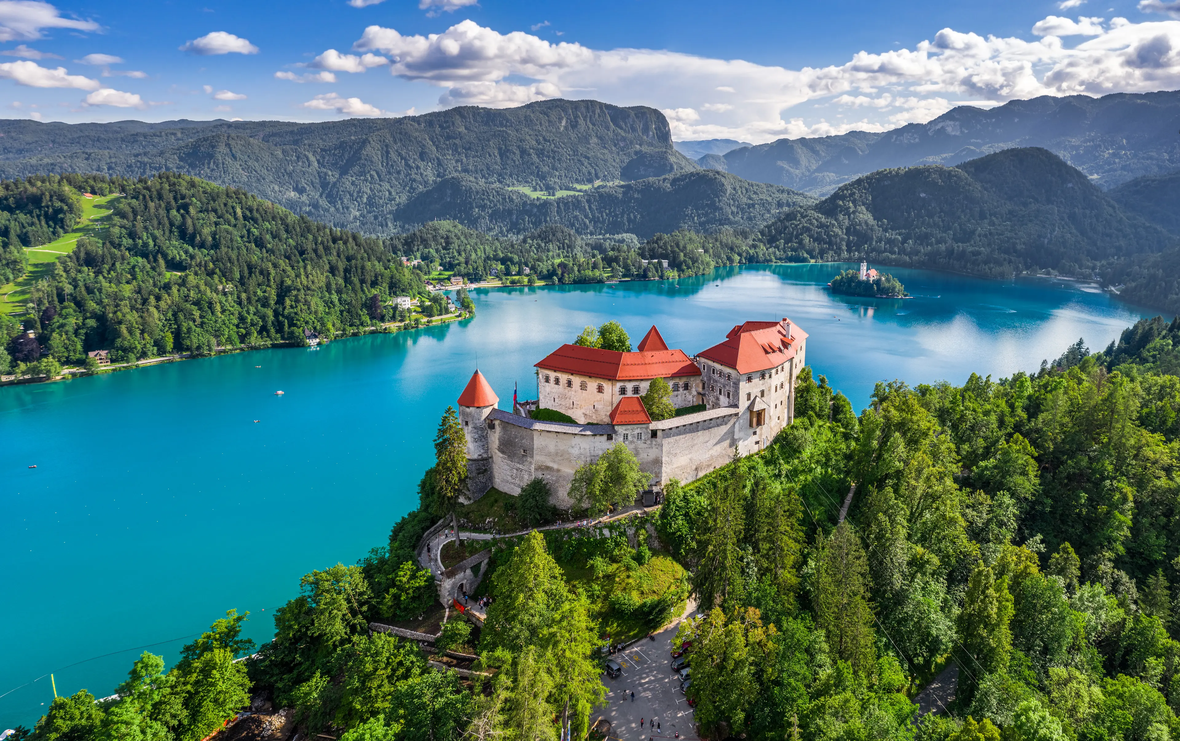 Bled Castle (Blejski Grad) with Lake Bled (Blejsko Jezero), the Church of the Assumption of Maria and Julian Alps at background