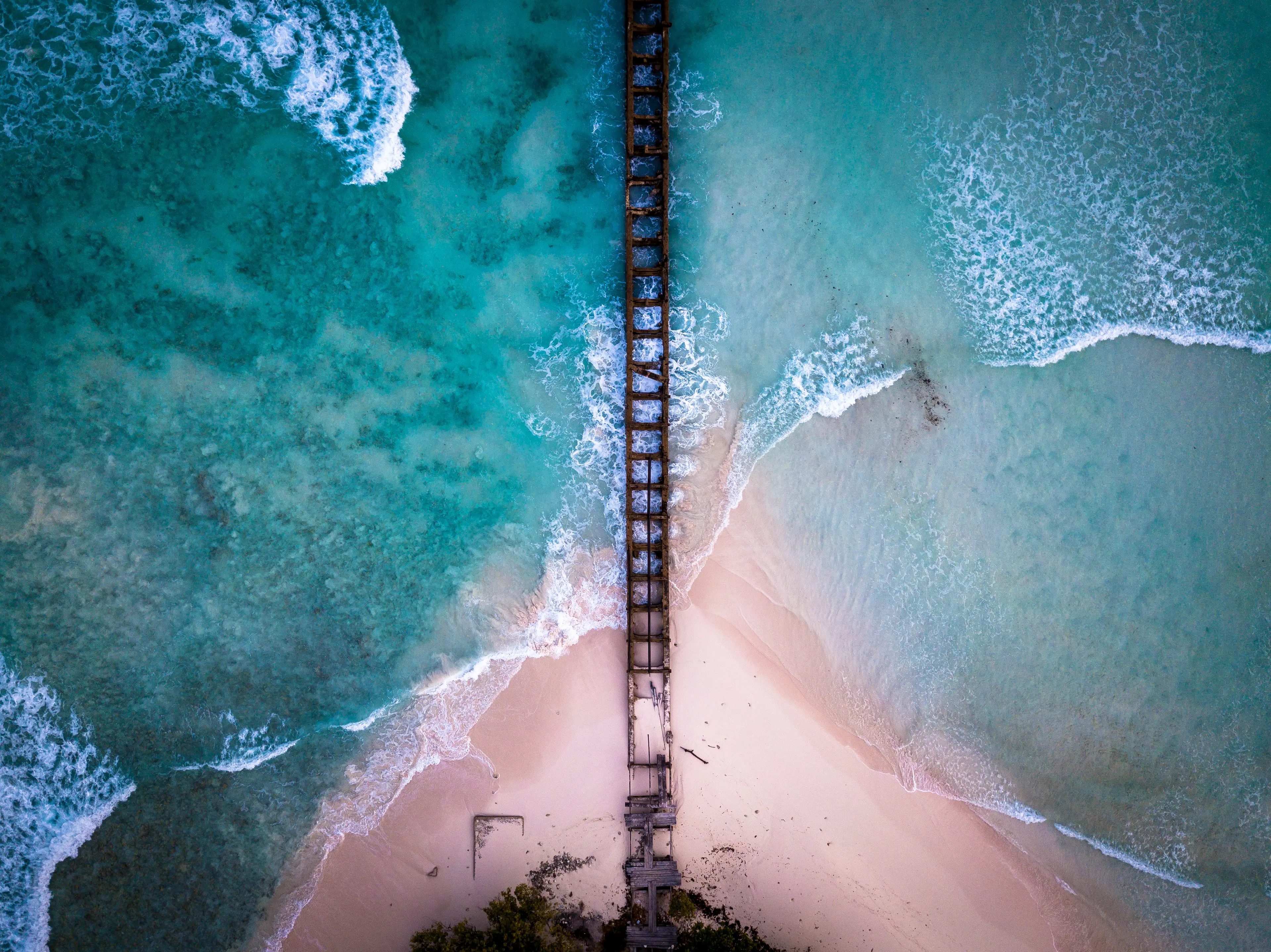 Aerial view of an old pier and the Carribean coastline