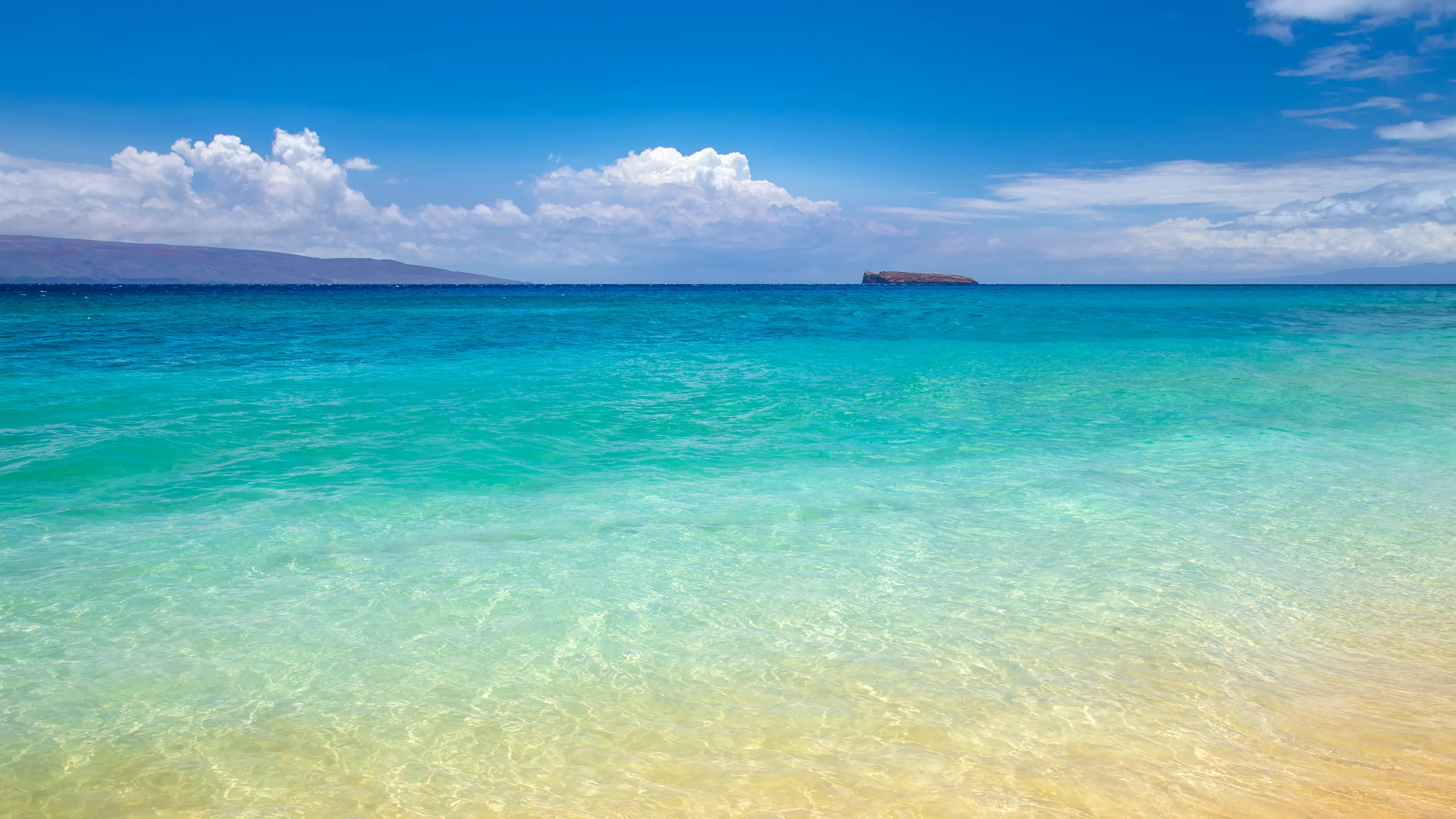 Makena Beach with Molokini crater at the horizon Makena Beach with Molokini crater at the horizon