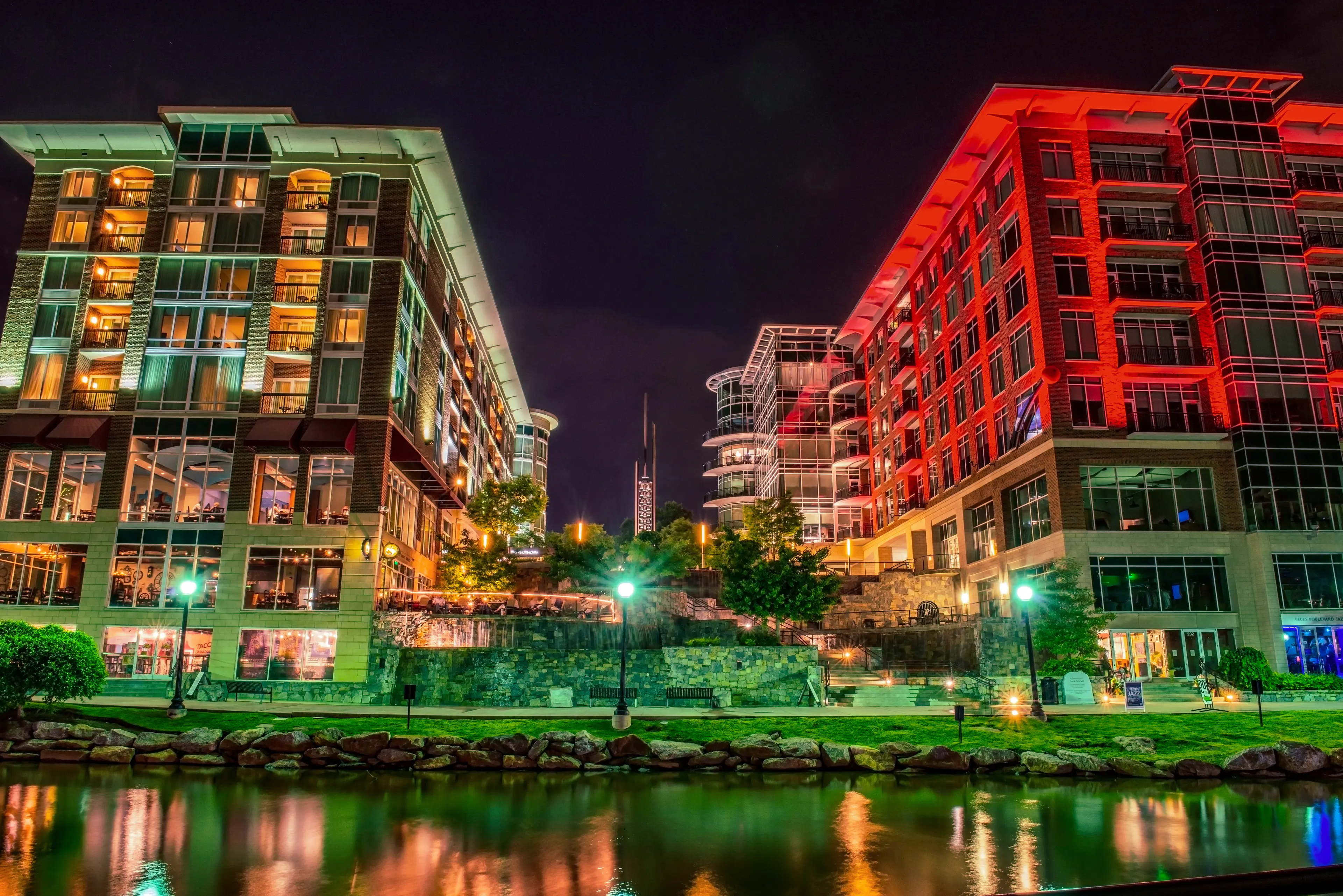 Greenville buildings on the river at night