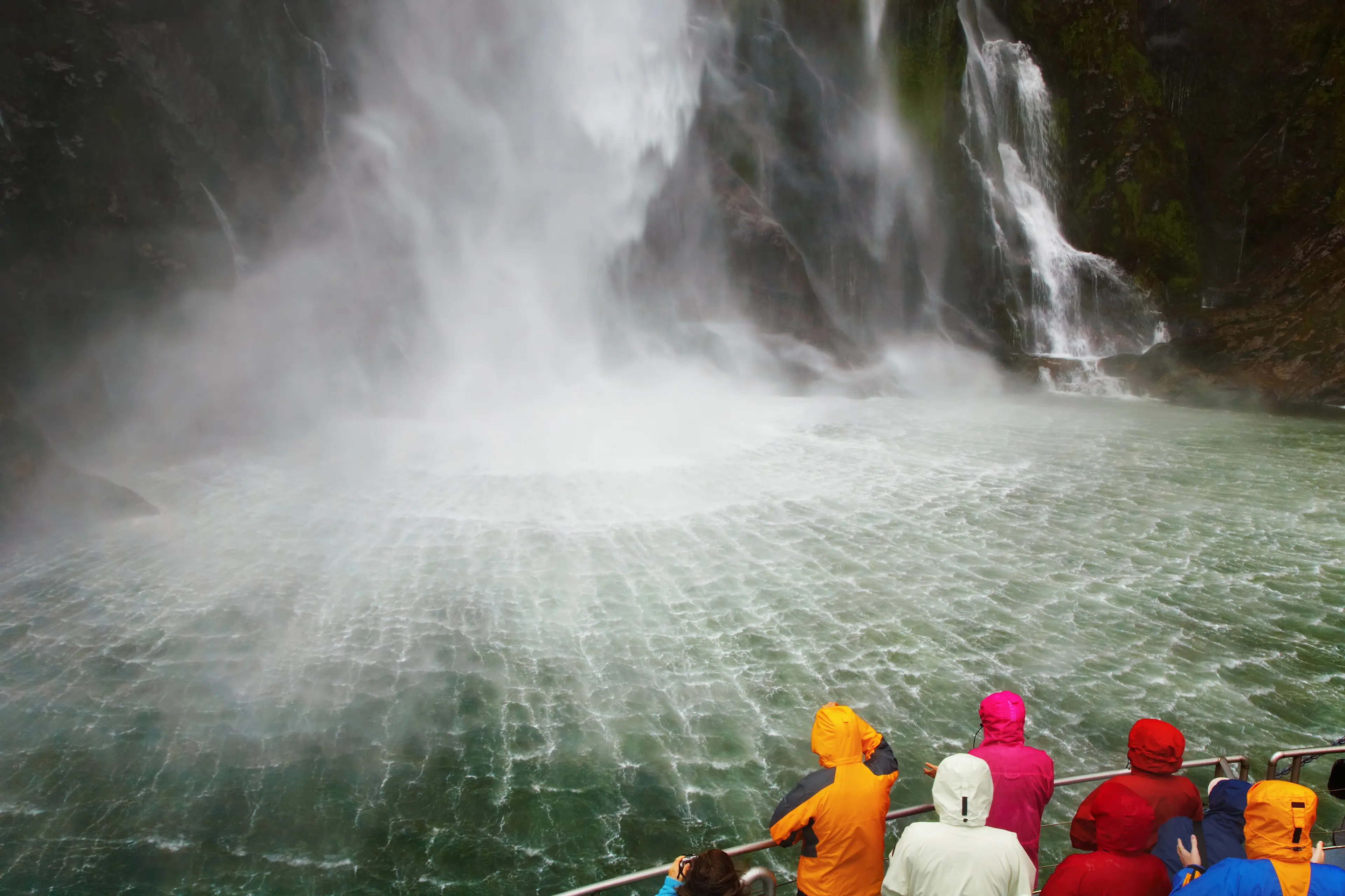 Tourist boat approaching the waterfall Tourist boat approaching the waterfall
