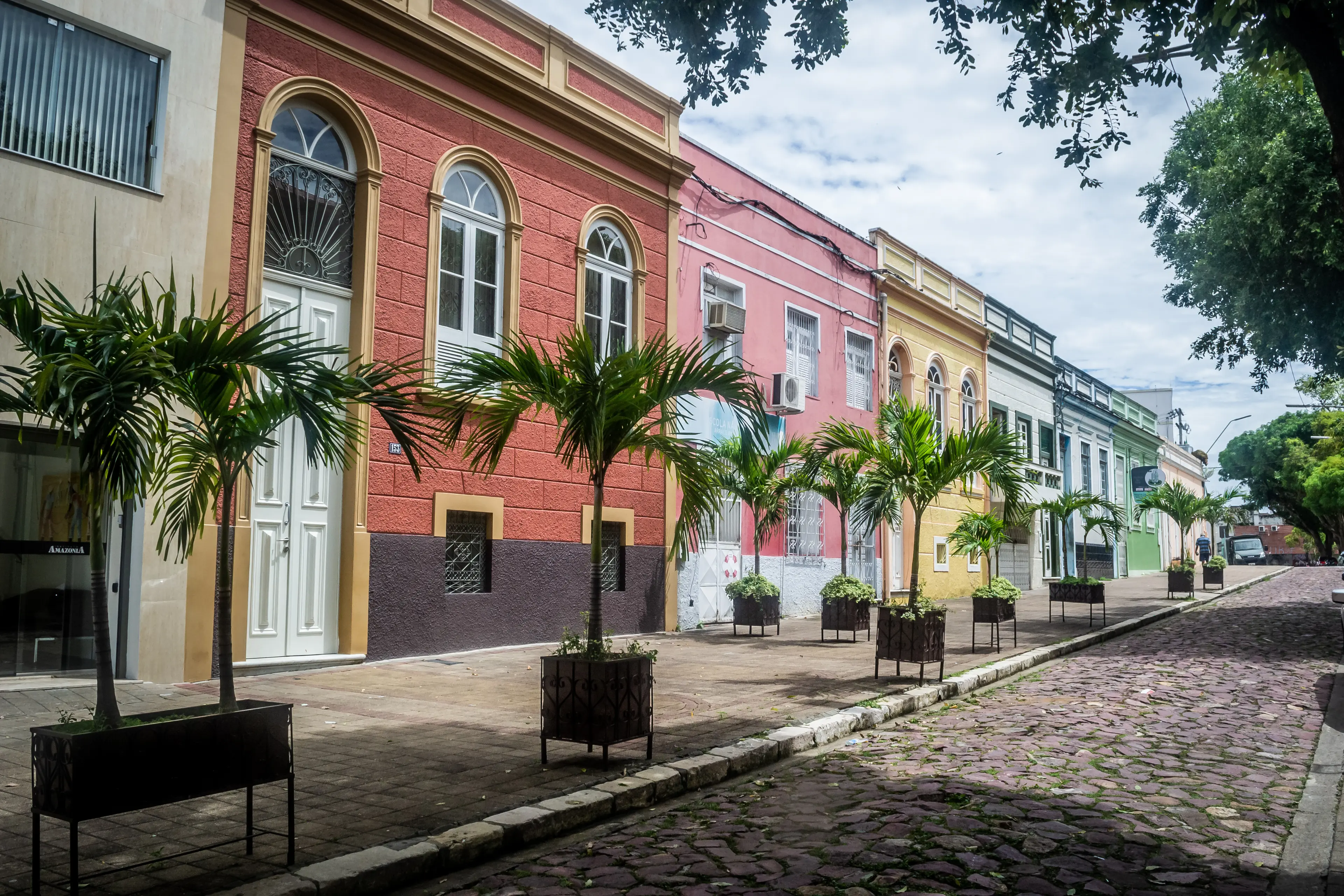 Cobblestone street with colorful houses at Manaus