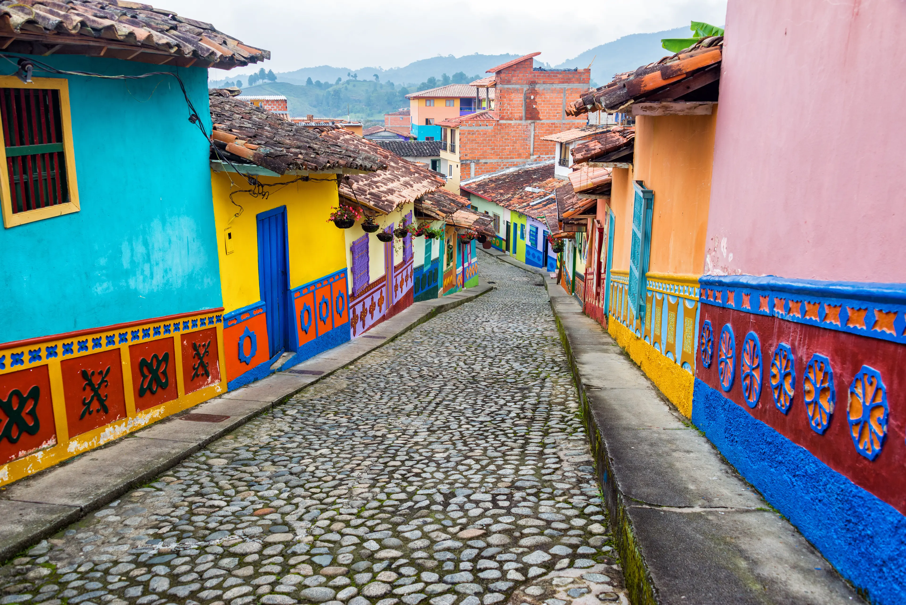 Colorful buildings on both sides of a cobblestone street